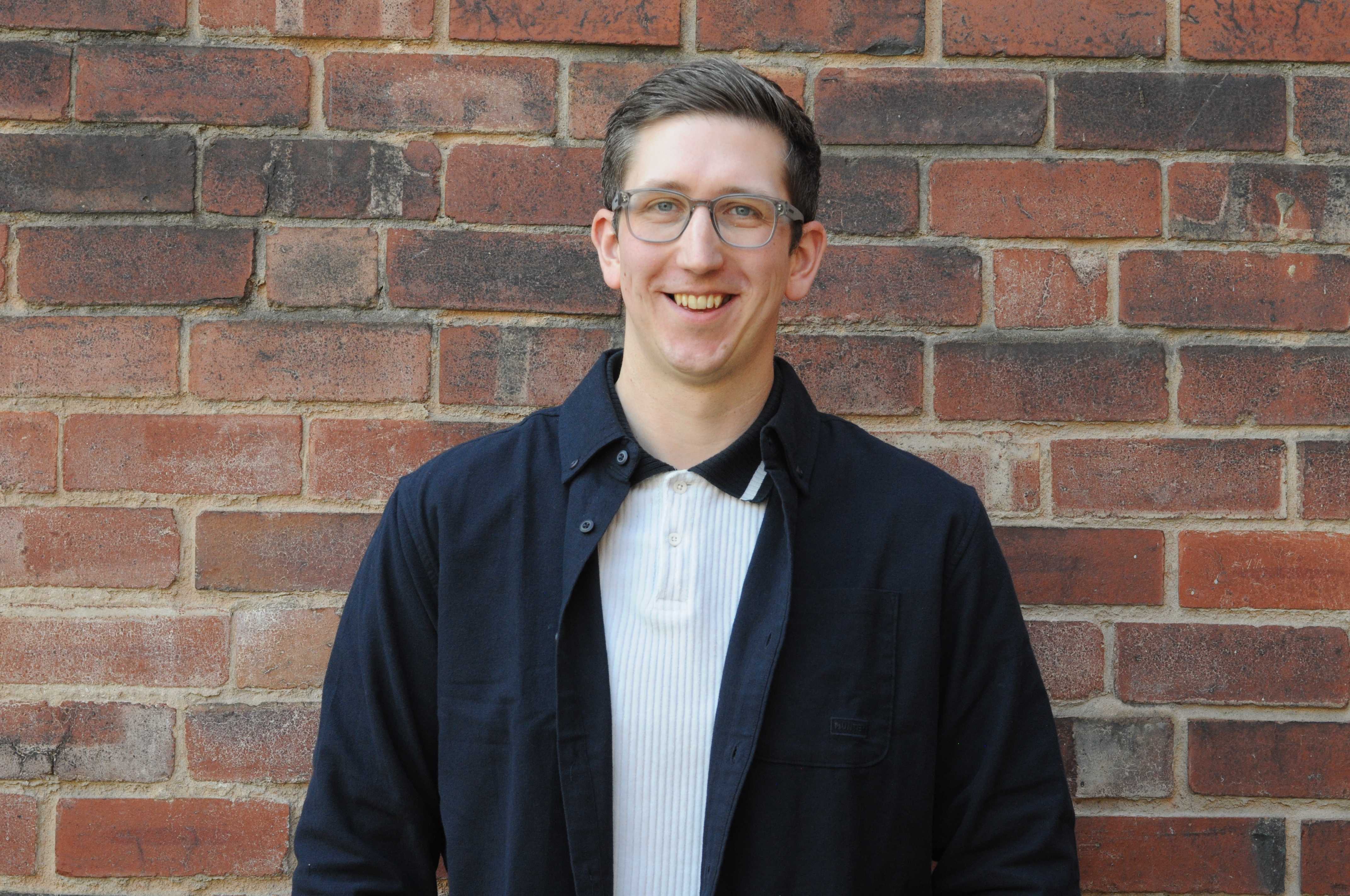 Picture of Lee on brick background