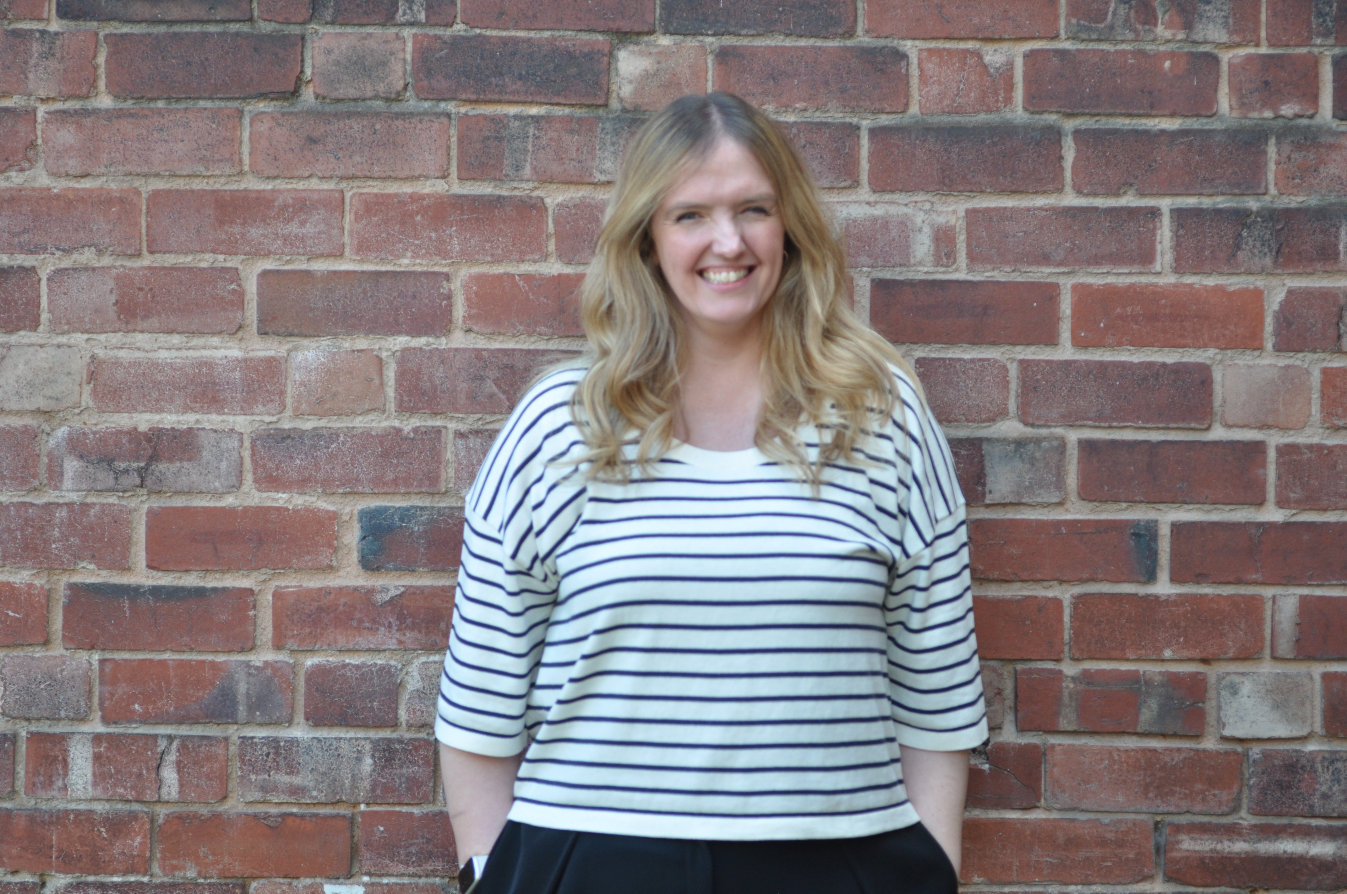 Picture of Laura Smith on brick background