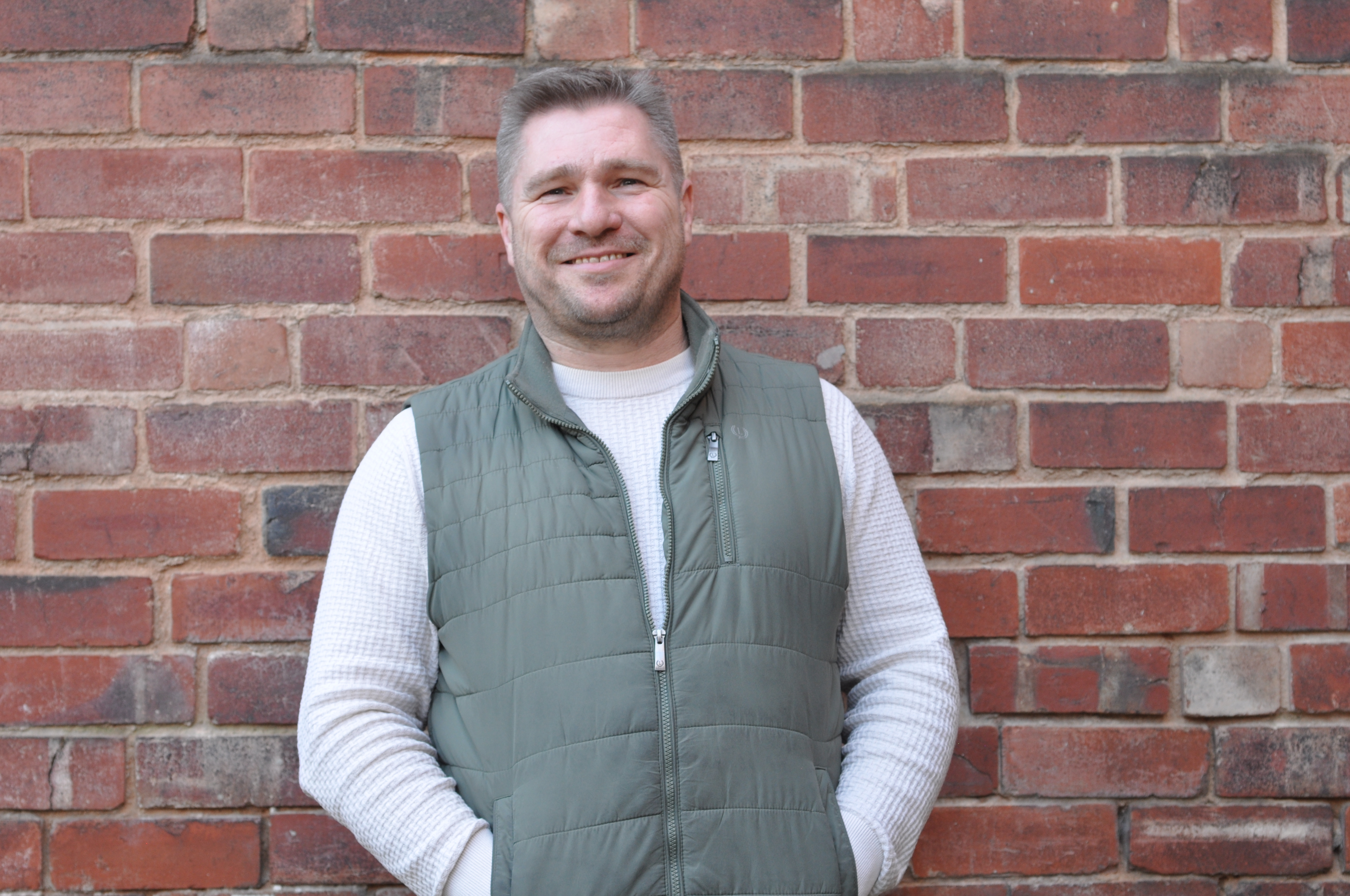 Image of Mike on brick background