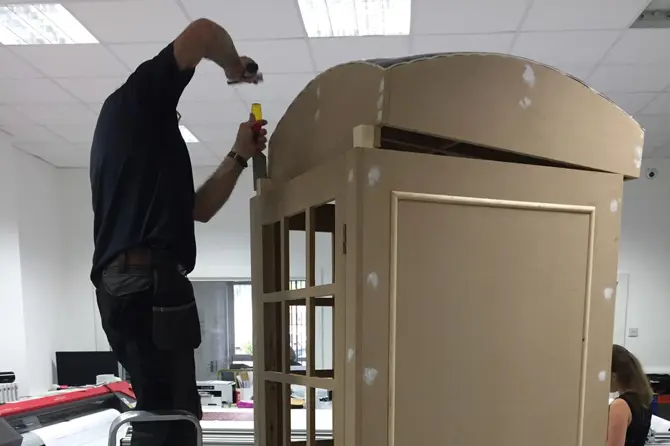 telephone box being built out of wood