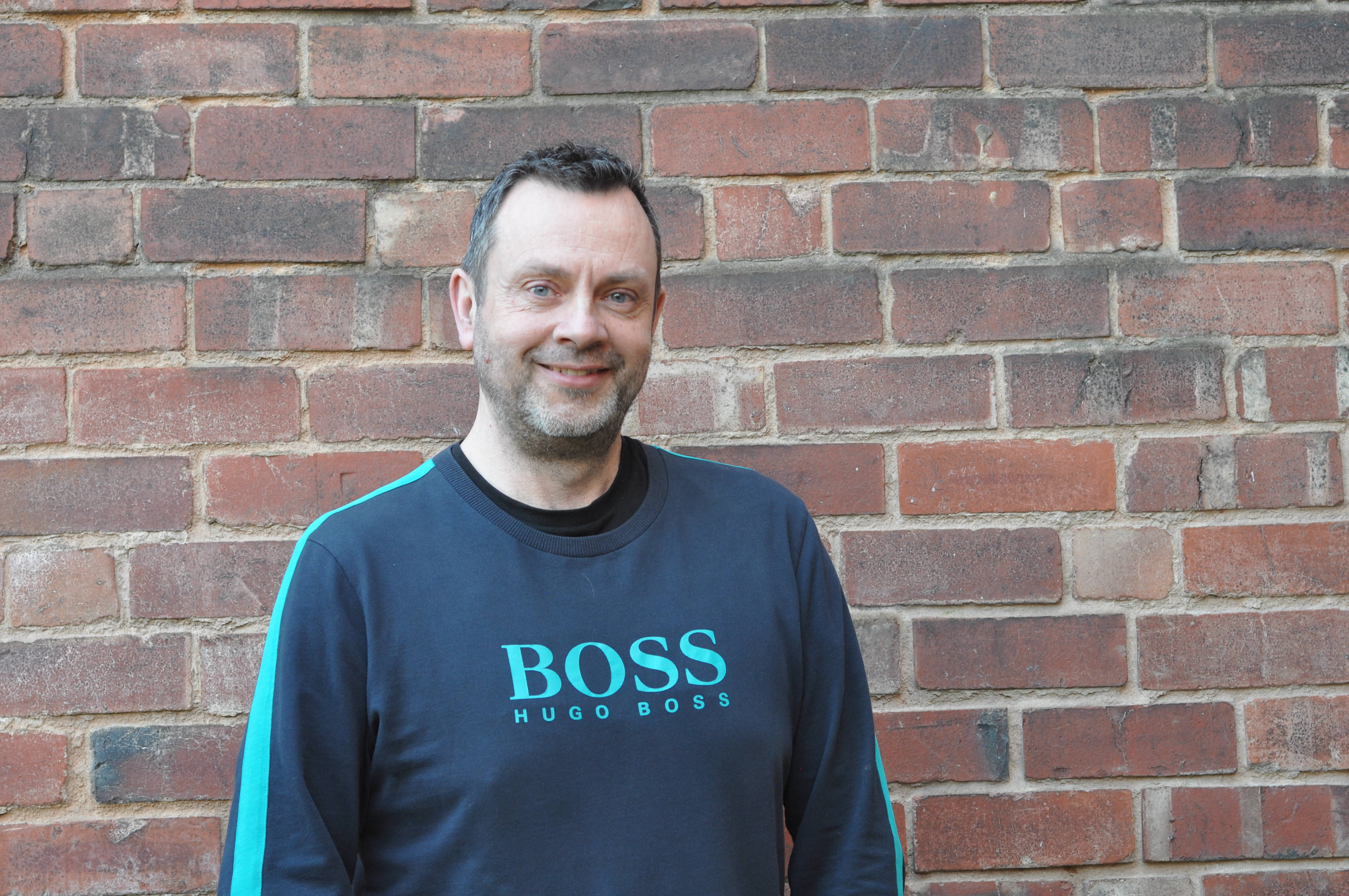 Image of James on brick background