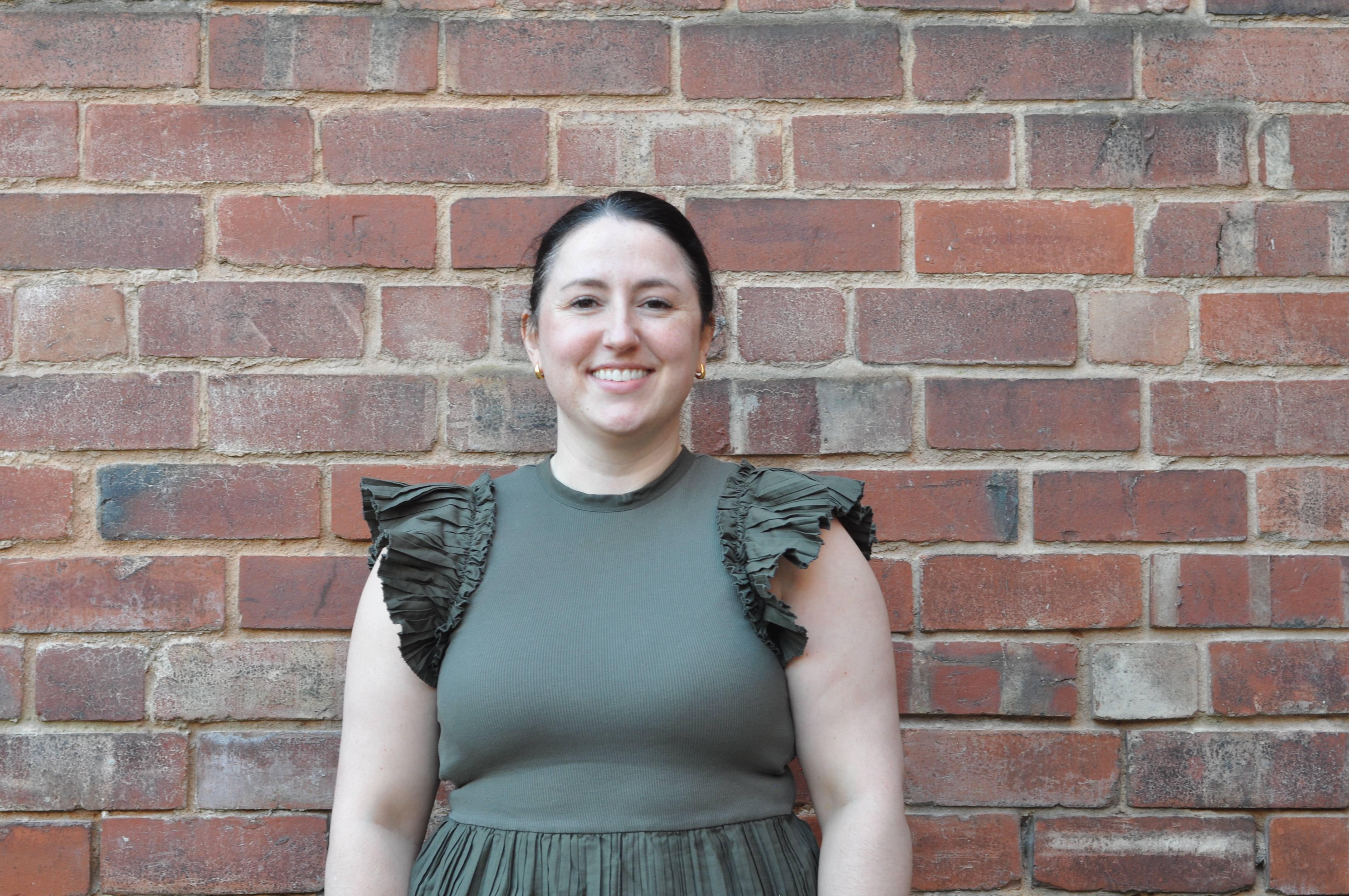 Image of Heather on brick background